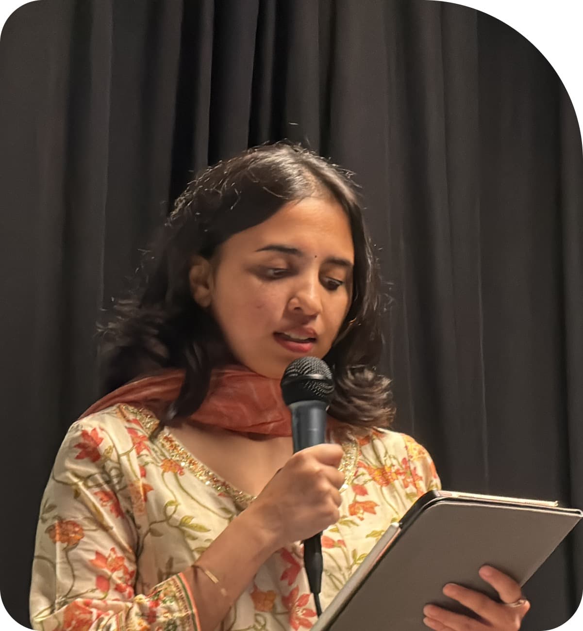 Neha presenting to an audience